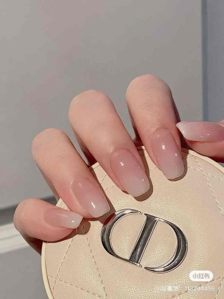 French manicure in this design features a color shift; transitions smoothly from a warm translucent blush pink base to milky white tips. The topcoat is extremely glossy to give ultra-fine nail shine.