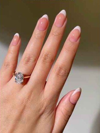 Old Money American Manicure - Soft off-white or milky nail tips with nude base color paint and the smile line is slightly blurred for American Manicure nails' elegance